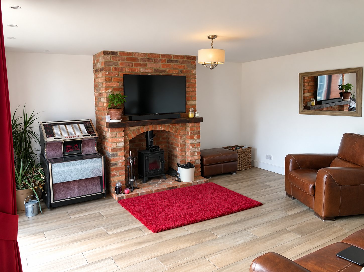 The new living room before the interior scheme, with plain white walls and a red rug