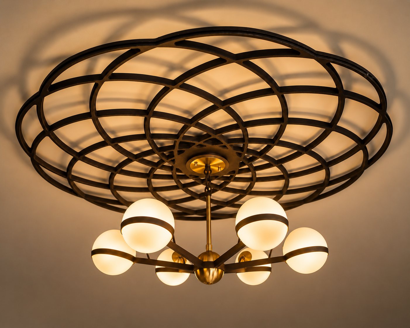 Art Deco globe ceiling light beneath a sculptural looped ceiling rose