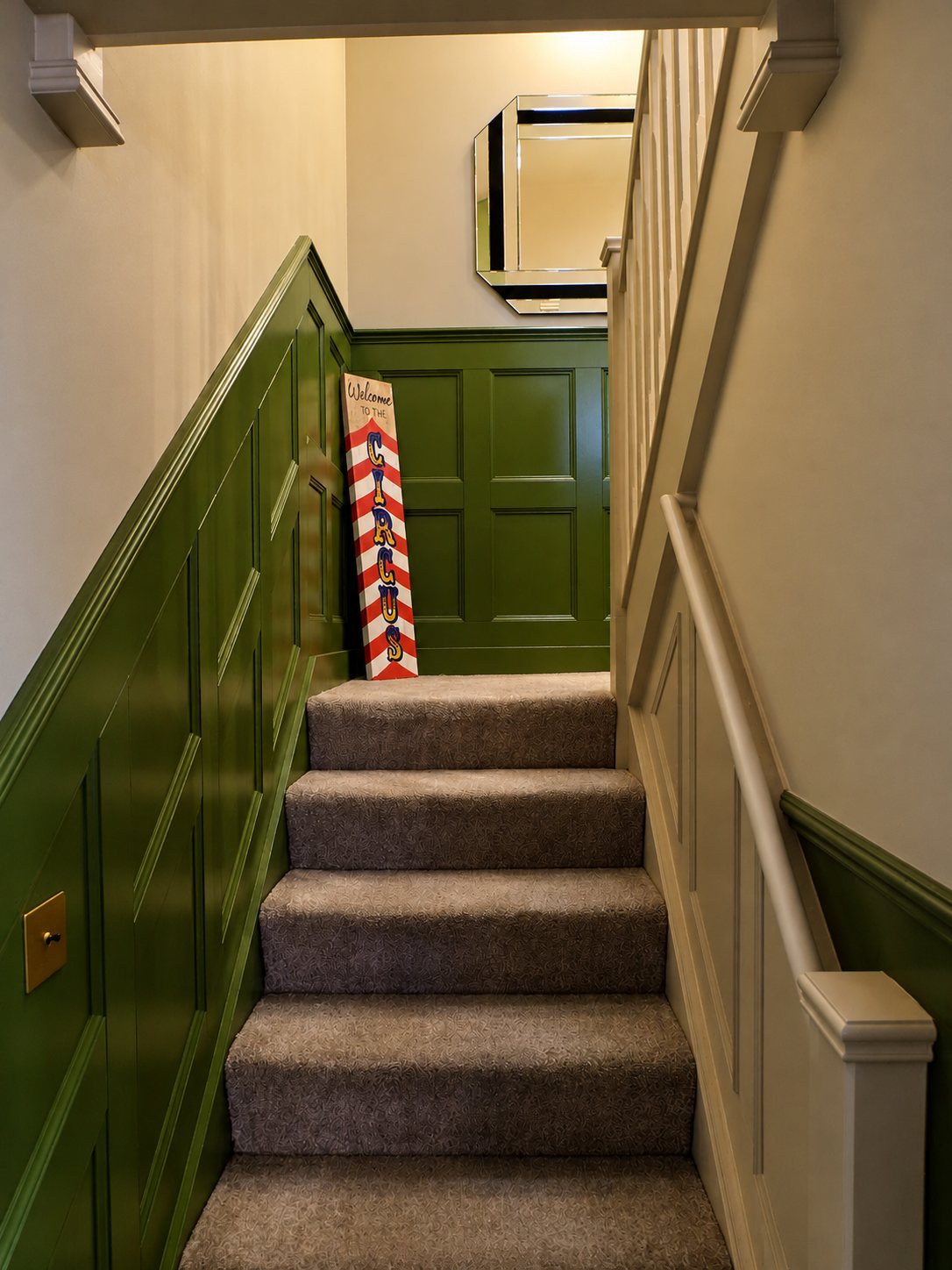 The staircase to the bedroom after, lined with green panelling