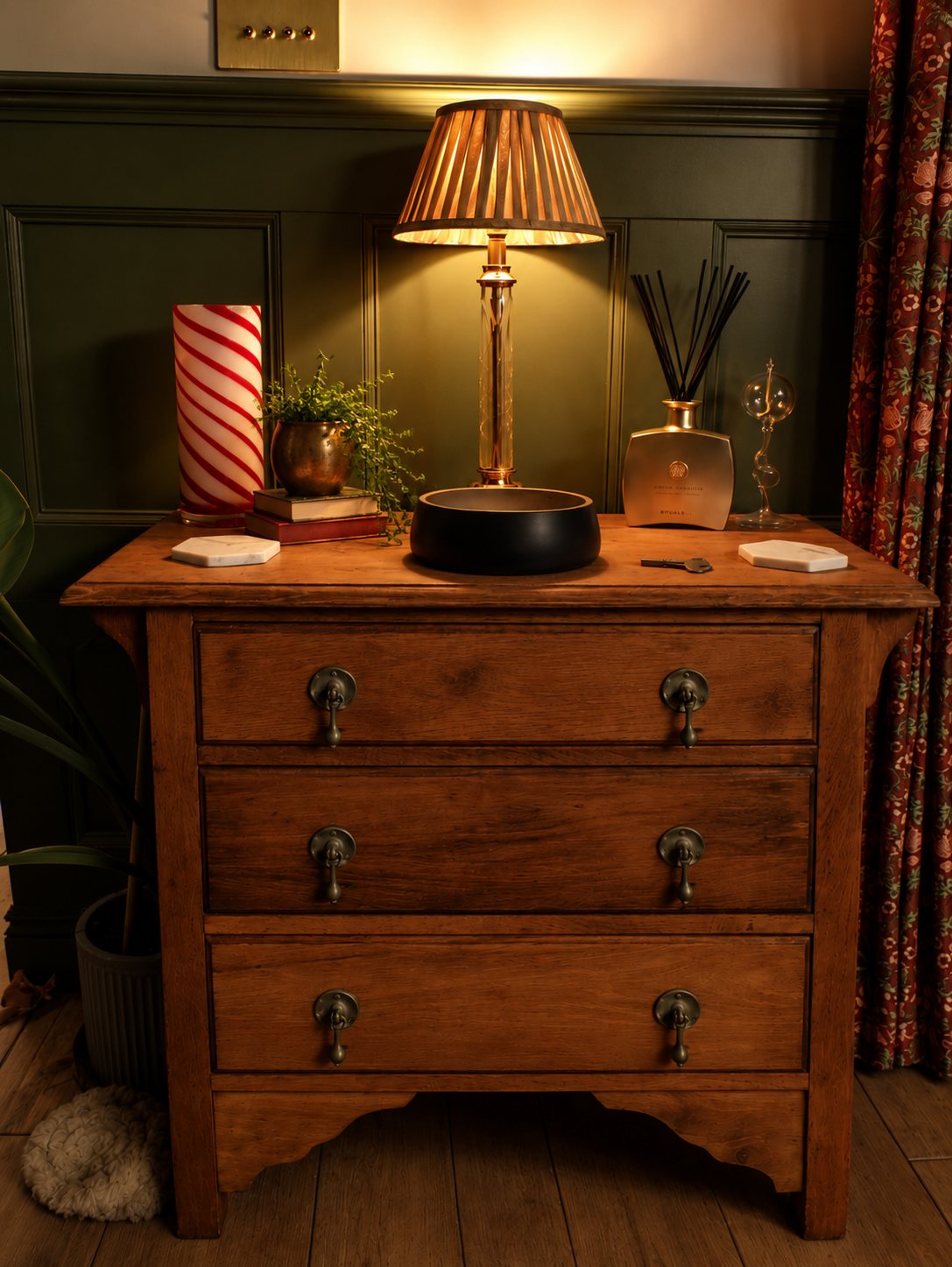 Restored vintage chest of drawers with a brass lamp in the bedroom